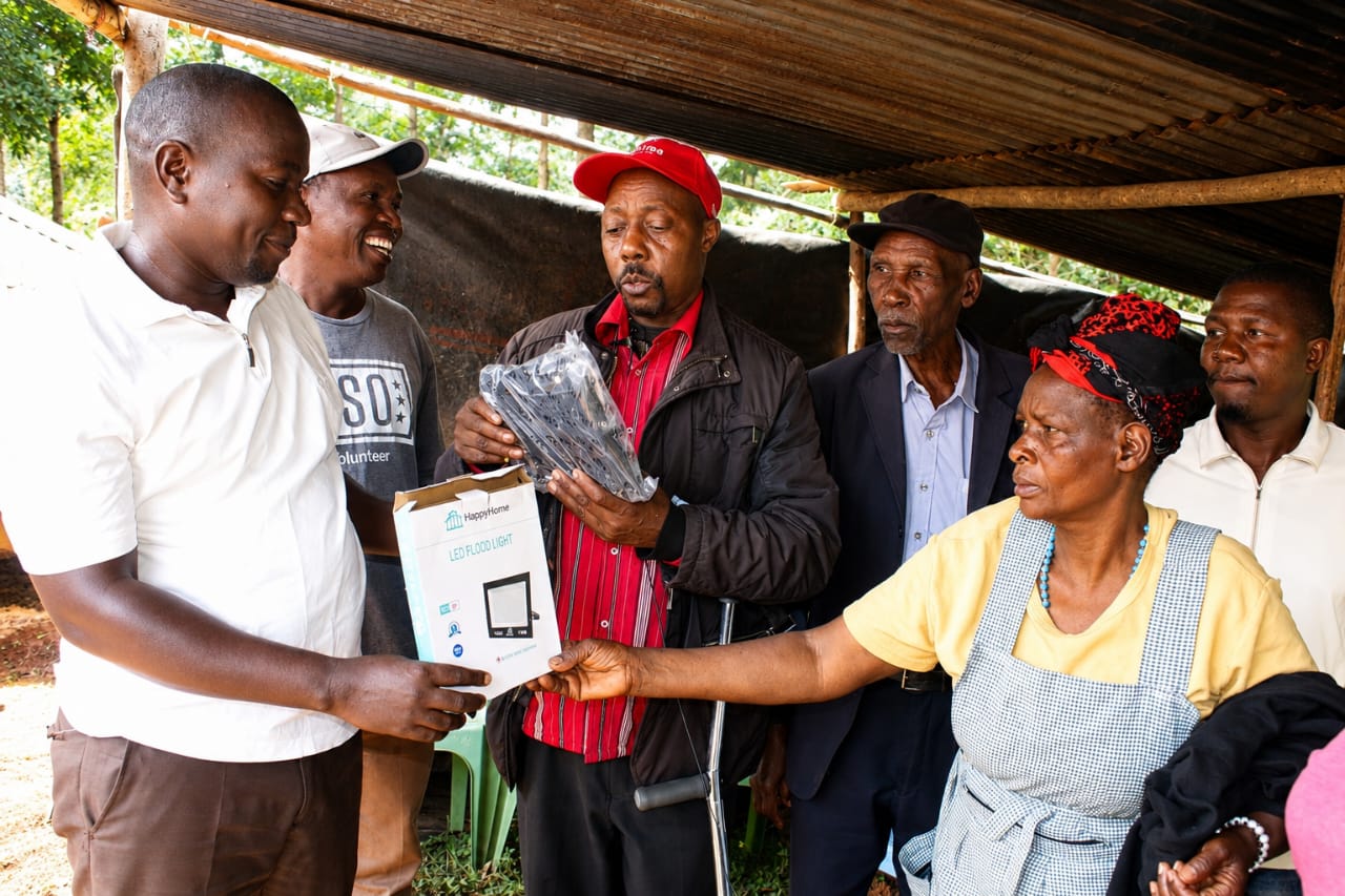 Daniel Ongoto (third right) launching lighting project at Nyatieko Ward